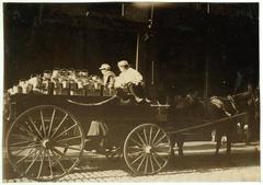 Boys selling grapes at a market in Boston, 1915