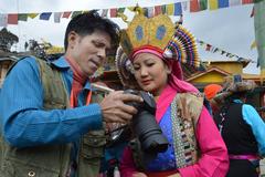 Photojournalist with Tibetan girl at Tawang