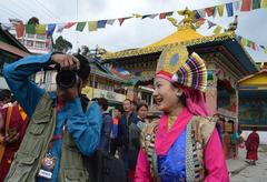 Photojournalist with Tibetan woman at Tawang, India