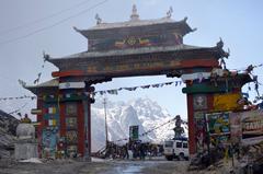 Sela Pass in Arunachal Pradesh, India with snow-covered mountains and winding roads