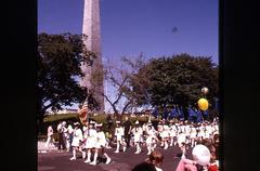 Bunker Hill Day parade from 1973 with crowds and American flags