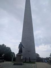 Bunker Hill monument exterior view with Colonel William Prescott statue