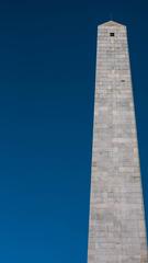 Bunker Hill Monument against a clear blue sky