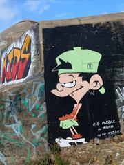 Kid Paddle cartoon character on a bunker at Longchamps beach