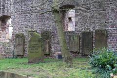 Gravestones and memorial stone for the victims of both World Wars next to Dreieichenhain's Burgkirche