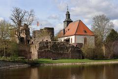 Ruins of Hayn Castle with castle church and pond in Dreieich