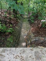 Jinonický Brook bed near Pod Vavřincem Street lined with old oaks