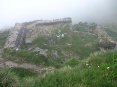 Cathar building ruins in the mist on the slopes of Montségur