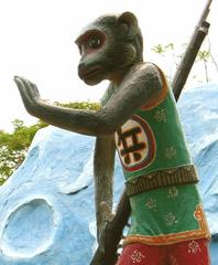 Armed monkey statue at Haw Par Villa in Singapore