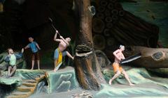 Axing and sawing down trees display Haw Par Villa