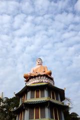 Buddha statue atop a pagoda at Haw Par Villa