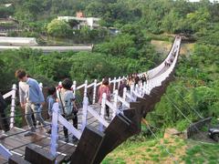 Tourists walking on Baishihu Suspension Bridge