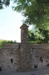 Stone cross near Saint-Étienne Church in Palaja