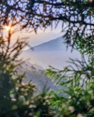 Sunset over misty valley in Kerala