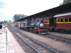 Anhumas Station in Campinas features a historic train and platform under a clear sky