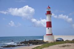 Farol de Itapuã lighthouse on a sunny day with a blue sky