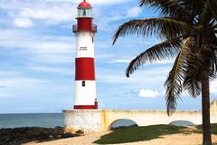 Farol de Itapuã lighthouse under a clear blue sky