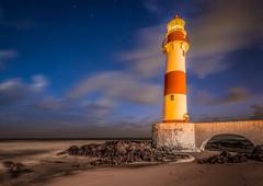 Farol de Itapuã at night