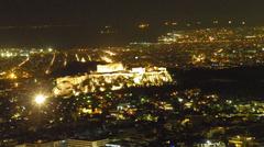 Acropolis of Athens illuminated at night with planets Jupiter, Venus, and Mercury visible in the sky.