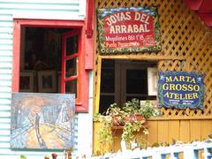 Street view of La Boca neighborhood in Buenos Aires with colorful buildings and street art