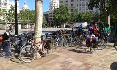 cyclists at the Plaza del Ayuntamiento in Valencia