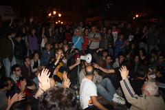 Democracia Real Ya meeting in Valencia with people raising hands and using sign language for applause