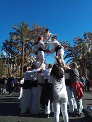 Marieta figurine baptizing a young muixeranguer of the Muixeranga de València at the Plaça de l'Ajuntament during the Festa de la Infantesa 2019