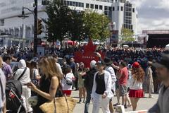 Canada Day 2024 celebration at Canada Place with a large crowd and festive decorations