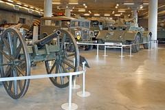 A variety of war equipment on display in a museum