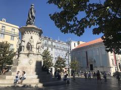 A scenic view of Lisbon showcasing historic architecture, waterfront, and a hilly landscape