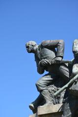 Determined man climbing a rocky mountain