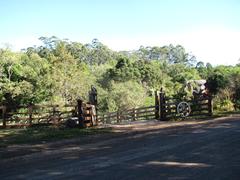 wooden farm gate in rural landscape