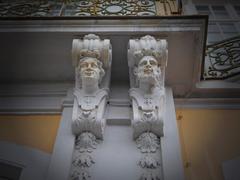 Detailed figure sculptures on façade of Augustusburg Palace in Brühl, Germany