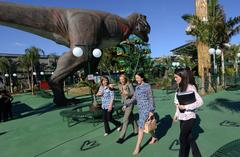 T-Rex statue at the park inauguration in Brazil