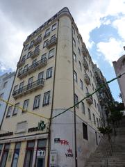 two-story yellow corner house