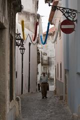 old man walking on Lisbon street