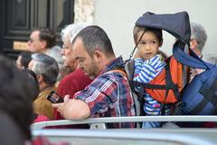 Child with a red nose in Lisbon street