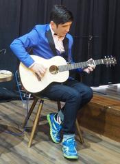 Joseph Yeh playing guitar at Sanchong Air Force Military kindred Village No.1 in New Taipei City