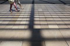 Light and shadow play on the ground in front of Carré d’Art cultural center in Nimes by architect Norman Foster