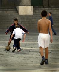 Children playing soccer in Piazza del Plebiscito