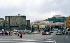 Castel Sant'Elmo on a hill in the background and Stazione Maritima with Piazza Municipio in the foreground