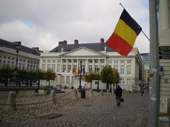 The flag of Belgium flying high at Martyrs' Square in Brussels, Belgium