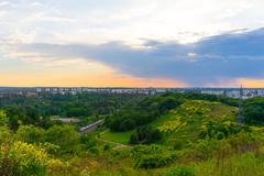 sunset view of a train passing through an urban landscape in Stockholm, Sweden