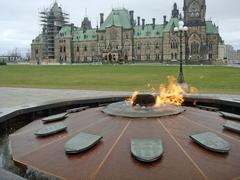 Centennial Flame in Ottawa with Parliament Hill in the background