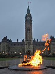 National War Memorial in Ottawa with flowers and condolence messages