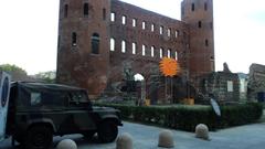 Caserma Alpini building with mountainous background