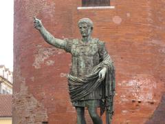 Statue of Caesar Augustus in Turin in front of Palatine Towers