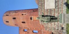 Eastern tower of Turin's Roman Palatine Gate with the statue of Julius Caesar