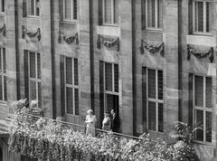 Princess Juliana giving a speech from the balcony of the Royal Palace in Amsterdam on September 4, 1948, with Queen Wilhelmina and Prince Bernhard