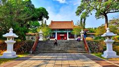 View of Kaohsiung Martyrs' Shrine with traditional Chinese architecture and stone lanterns remains